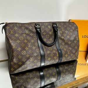 SOLD on cross post      Authentic Louis Vuitton Keepall 45 duffle black vachetta